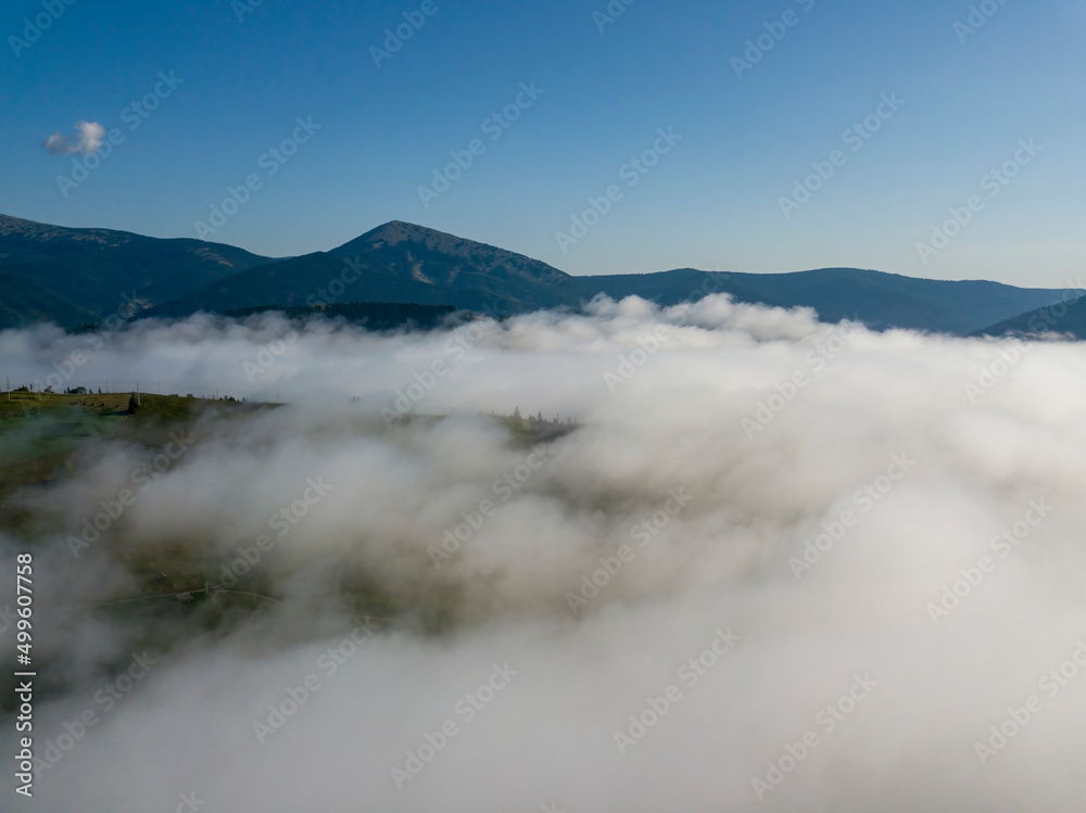 Morning fog in the Ukrainian Carpathians. Aerial drone view.