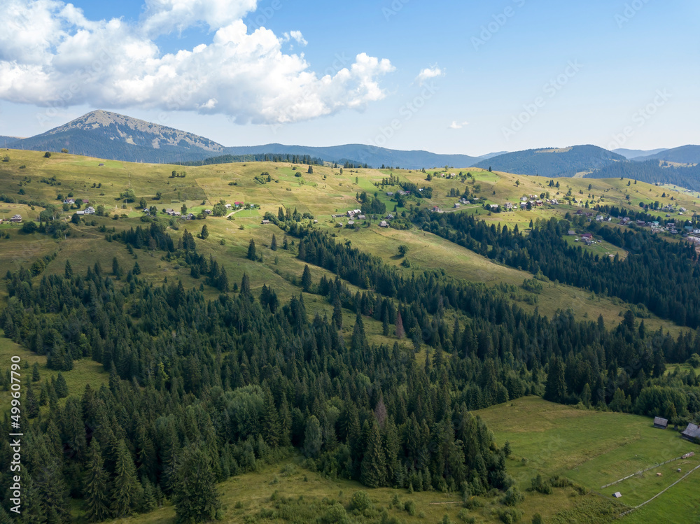 Green mountains of Ukrainian Carpathians in summer. Sunny day. Aerial drone view. Green mountains of Ukrainian Carpathians in summer. Sunny day. Aerial drone view.