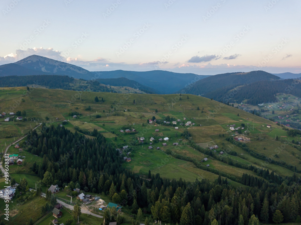 Sunset over the mountains in the Ukrainian Carpathians. Aerial drone view.