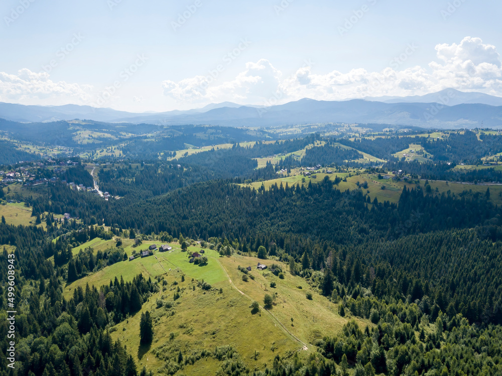 Green mountains of Ukrainian Carpathians in summer. Sunny day. Aerial drone view. Green mountains of Ukrainian Carpathians in summer. Sunny day. Aerial drone view.