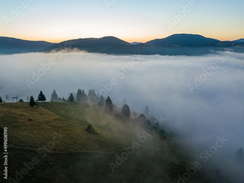 Morning fog in the Ukrainian Carpathians. Aerial drone view.