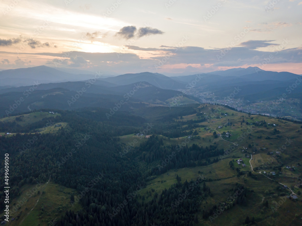 Fototapeta premium Sunset over the mountains in the Ukrainian Carpathians. Evening. Aerial drone view.