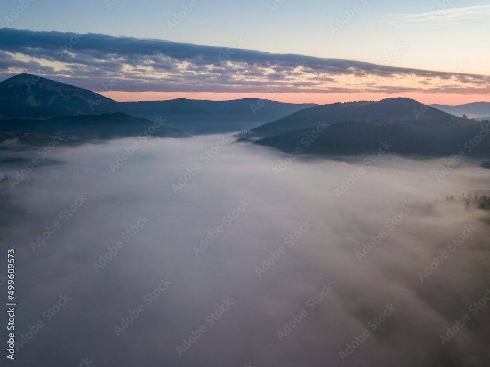 Morning fog in the Ukrainian Carpathians. Aerial drone view.