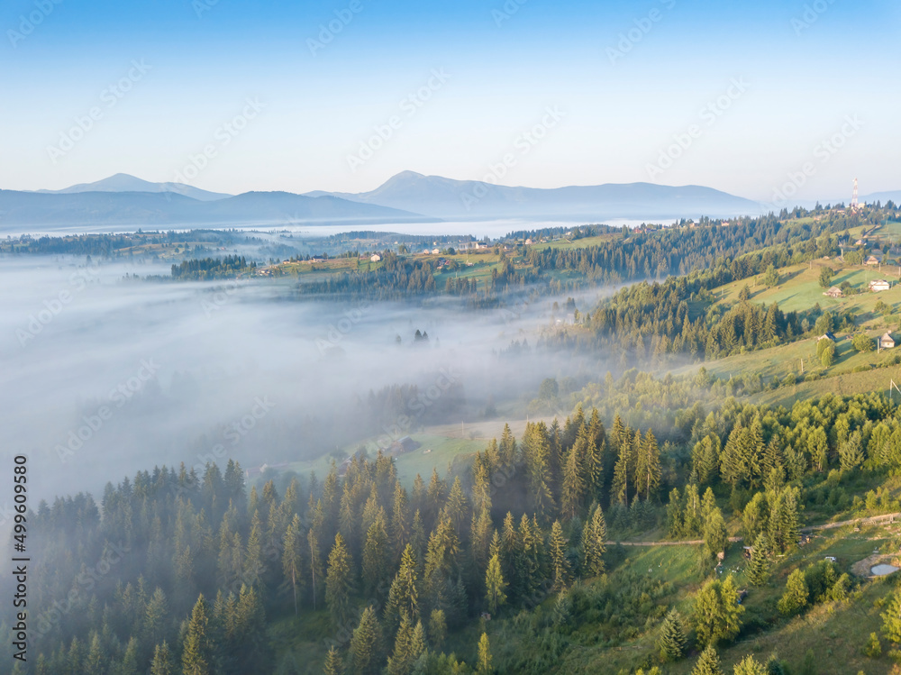 Fototapeta premium Morning fog in the Ukrainian Carpathians. Aerial drone view.