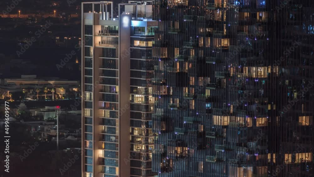 Windows in building exterior in the late night with interior lights on timelapse Windows in building exterior in the late night with interior lights on timelapse