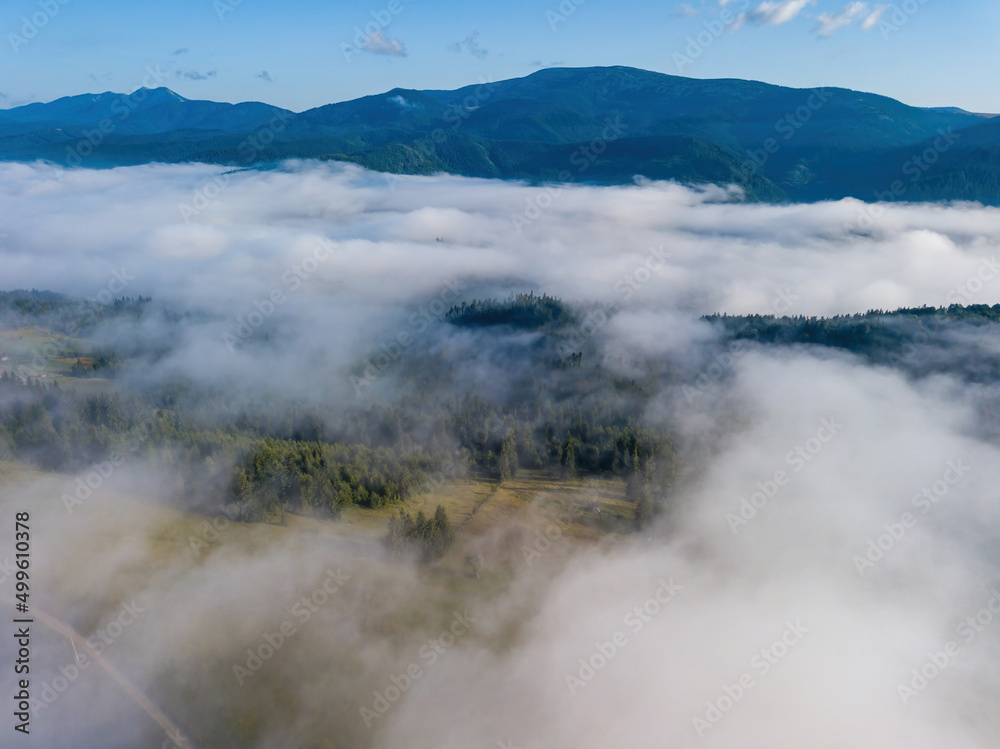 Foggy summer morning in the Ukrainian Carpathians. Aerial drone view.