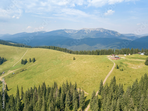 Green mountains of Ukrainian Carpathians in summer. Sunny day  rare clouds. Aerial drone view.