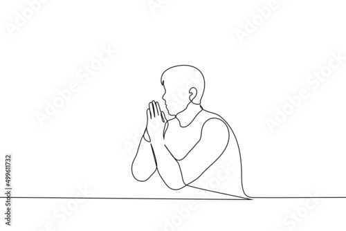 man is sitting at a table his hands are clasped together in supplication - one line drawing vector. concept of prayer, rubbing the palms: thinking or sweating the palms