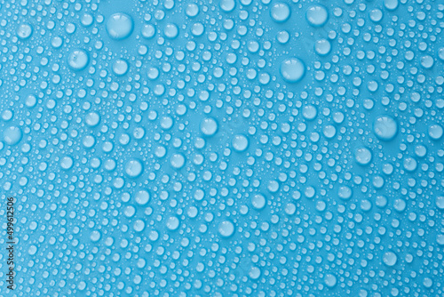 Water drops on blue background, top view of pattern with drop, flat lay as overlay