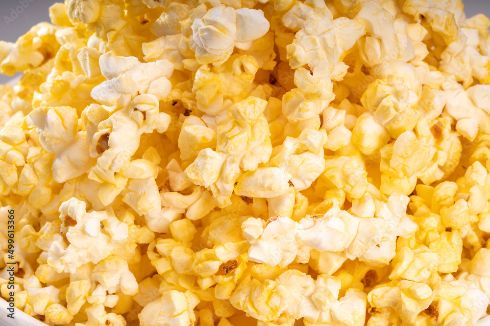 Popcorn in white paper bucket, Close up Popcorn on white cardboard. Popcorn in white paper bucket, Close up Popcorn on white cardboard.