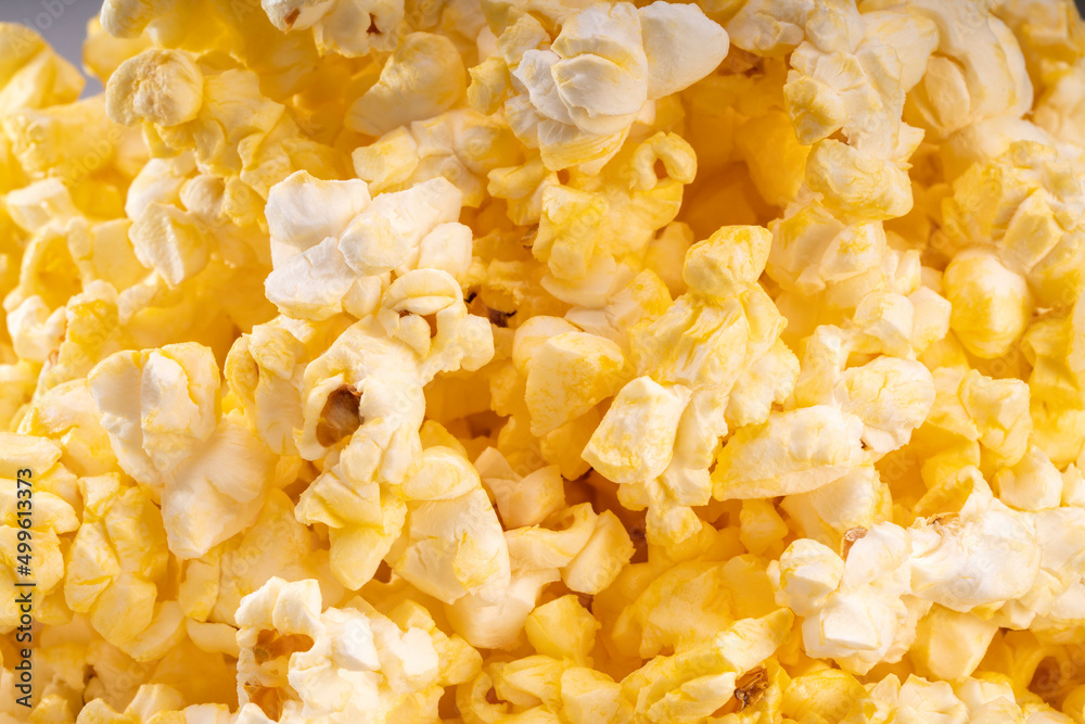 Popcorn in white paper bucket, Close up Popcorn on white cardboard. Popcorn in white paper bucket, Close up Popcorn on white cardboard.