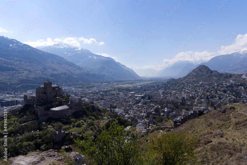 Fototapeta premium Beautiful medieval catholic church and castle Basilique de Valère (Valeria) on a hill at City of Sion on a sunny spring day. Photo taken April 4th, 2022, Sion, Switzerland.
