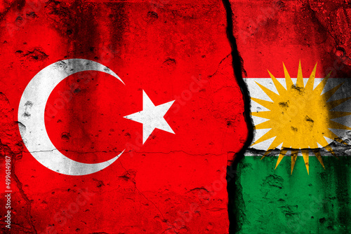 Turkey and Kurdistan conflict, war concept. National flags background on cracked concrete wall