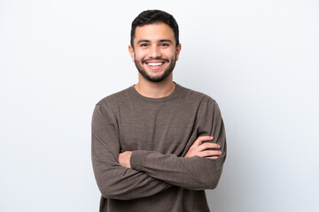 Young Brazilian man isolated on white background keeping the arms crossed in frontal position