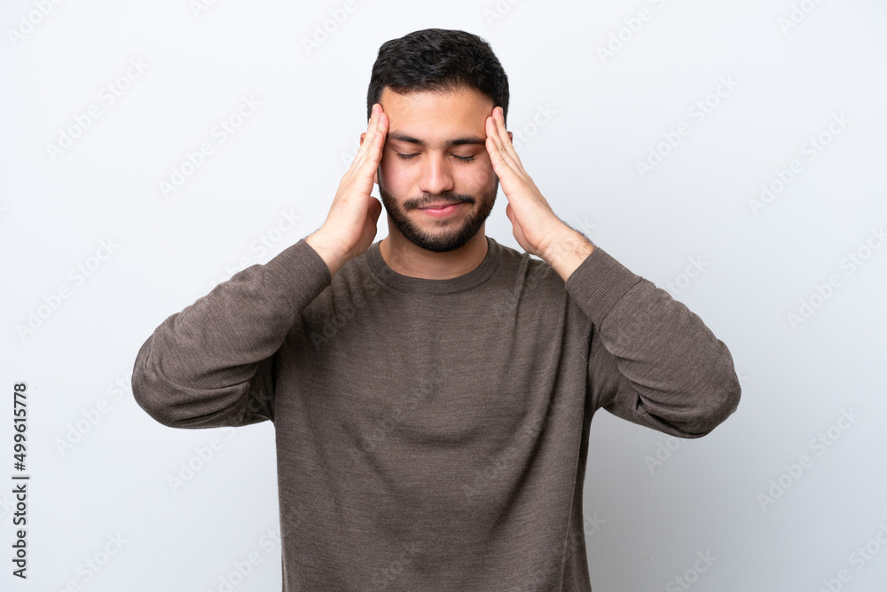 Young Brazilian man isolated on white background with headache Young Brazilian man isolated on white background with headache