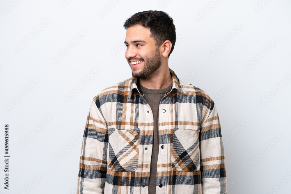 Young Brazilian man isolated on white background looking side Young Brazilian man isolated on white background looking side