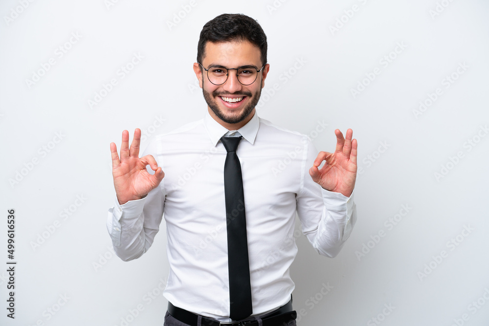 Business Brazilian man isolated on white background showing an ok sign with fingers Business Brazilian man isolated on white background showing an ok sign with fingers