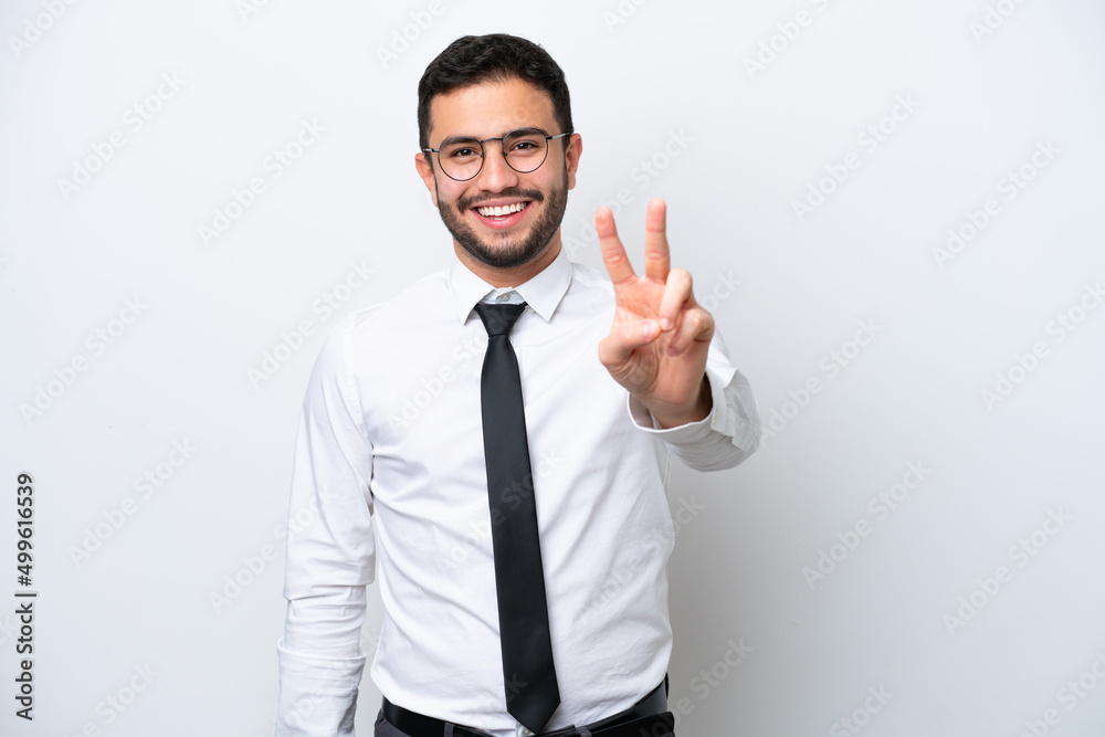 Business Brazilian man isolated on white background smiling and showing victory sign Business Brazilian man isolated on white background smiling and showing victory sign