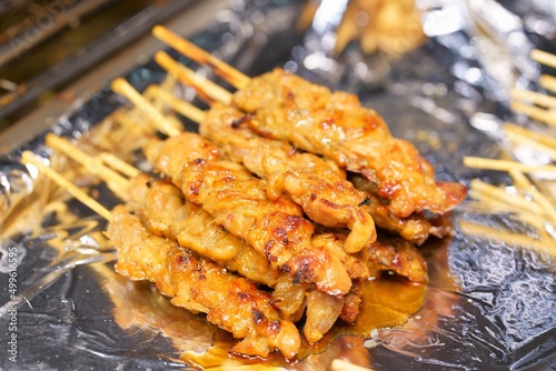 Close-up of grilled skewered milk pork on stick  thai street food market