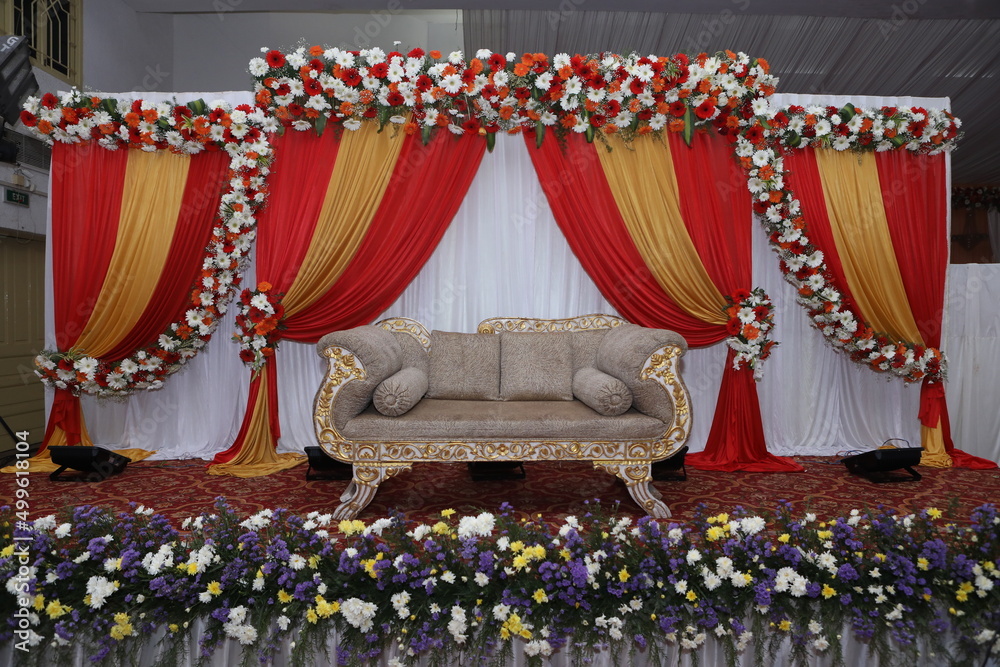 stage decorations with satin cloth and multi color flowers Stock Photo ...