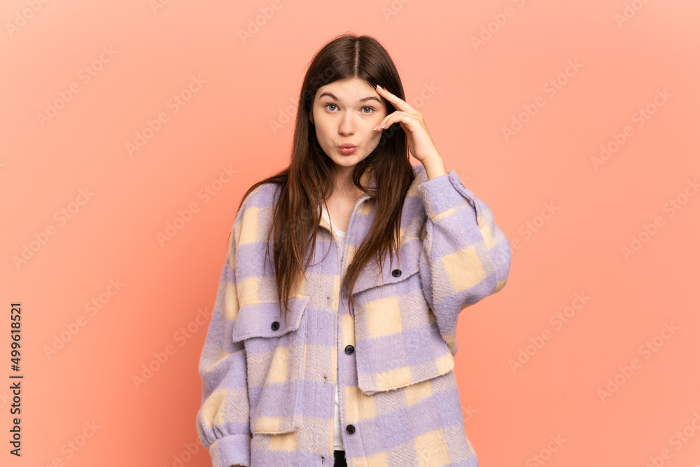 Young Ukrainian girl isolated on pink background has realized something and intending the solution Young Ukrainian girl isolated on pink background has realized something and intending the solution
