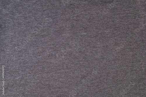 Grey knitted fabric cotton textured background. Closeup with copy space for your design