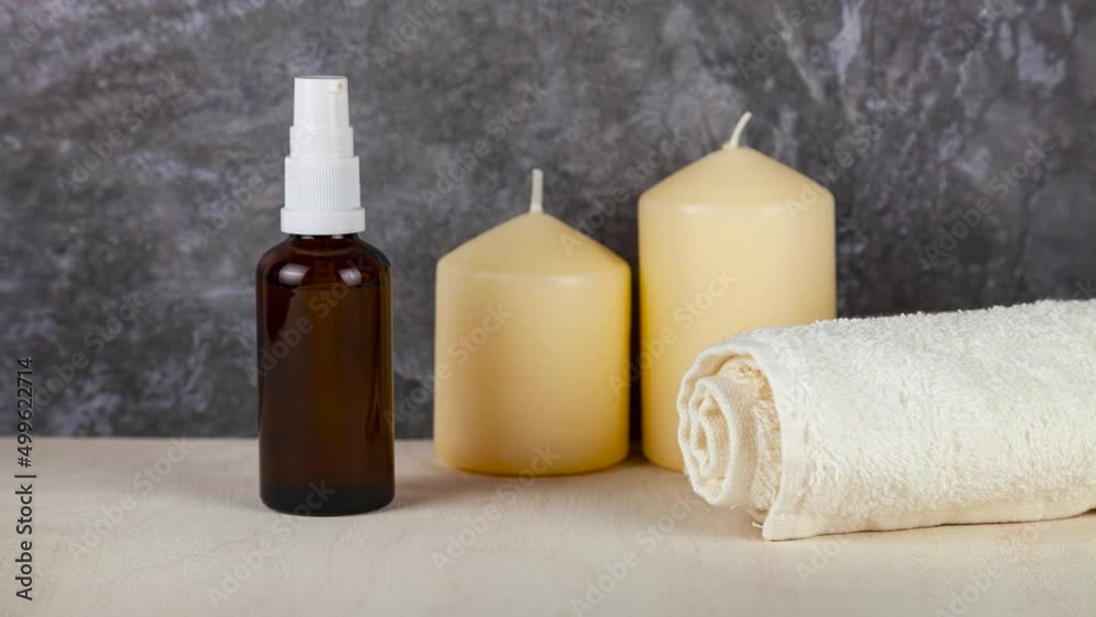 Natural organic eco cosmetics. SPA beauty salon branding mockup. Cosmetic containers with cream and lotion and candles on a dark background. 