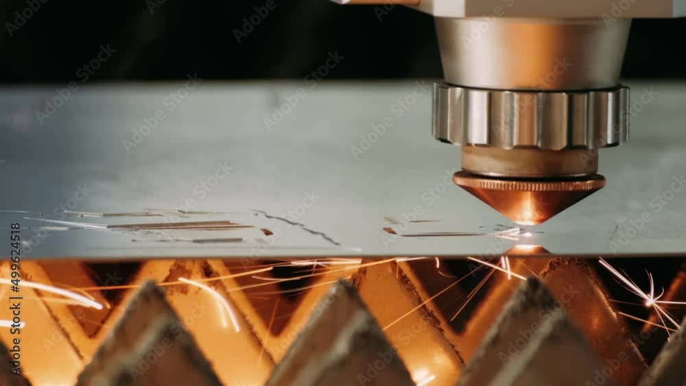 Automated plasma cutting of metal sheet on a modern laser cnc machine head on factory, industrial production of plasma metal cutting. Modern Technological Cnc laser Cutting close-up.