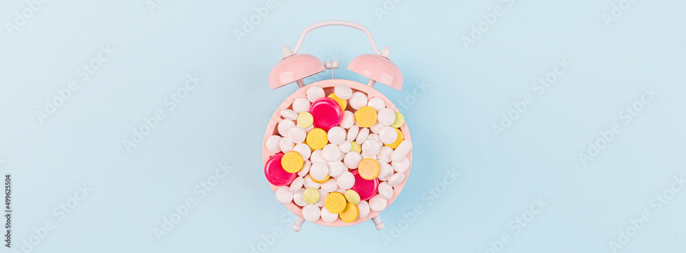 Colorful pills on a pastel blue background. Flat lay, top view, overhead, mockup, template. Pharmacy and medical concept Colorful pills on a pastel blue background. Flat lay, top view, overhead, mockup, template. Pharmacy and medical concept