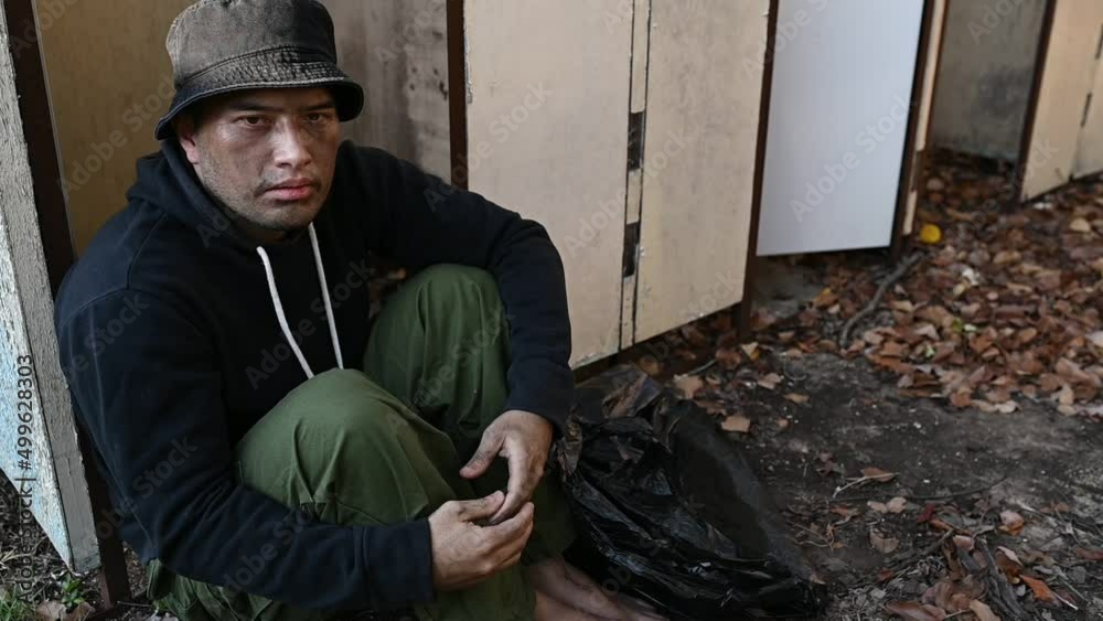 Asian man is homeless at the side road,A stranger has to live on the road alone because he has no family. Asian man is homeless at the side road,A stranger has to live on the road alone because he has no family.