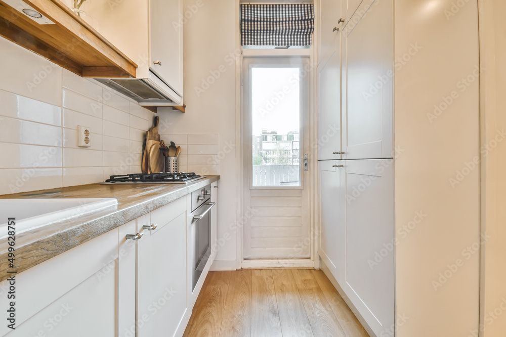 Fragment of interior of furnished kitchen with stove Fragment of interior of furnished kitchen with stove