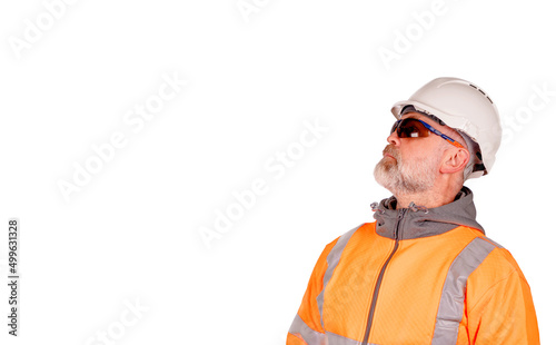 Wallpaper Mural A construction worker in orange hi-viz and tinted safety glasses looking up isolated on white background. Safety on construction site banner concept Torontodigital.ca