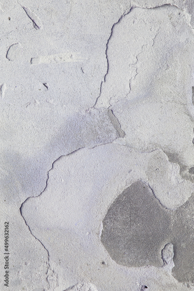 Obraz premium Old flaky wall with destroyed plaster. Renovation of old house. Industrial style design wall background. Grunge cracked concrete wall with old paint. Shabby peeling old background