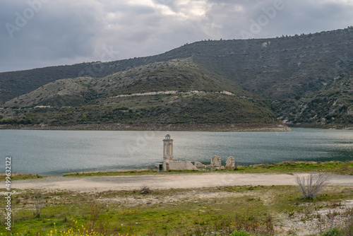 Ruined old church in Alassa, Cyprus is submerged under water of Kouris dam photo