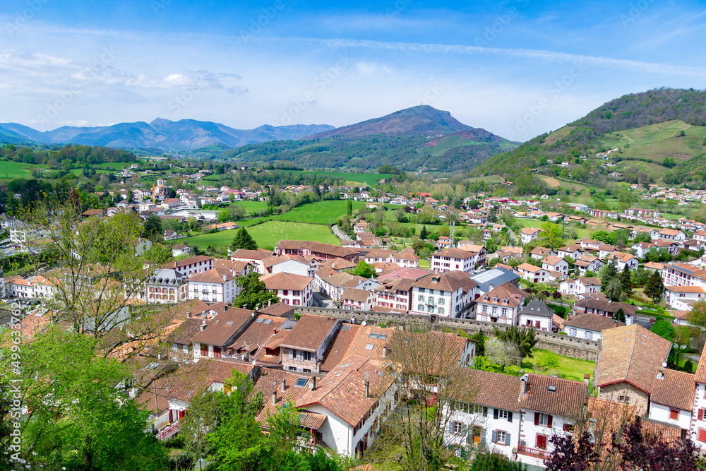 Cityscape of Saint Jean Pied de Port village, France. Views of the entire town with a panoramic view of a colorful landscape. Horizontal photography.