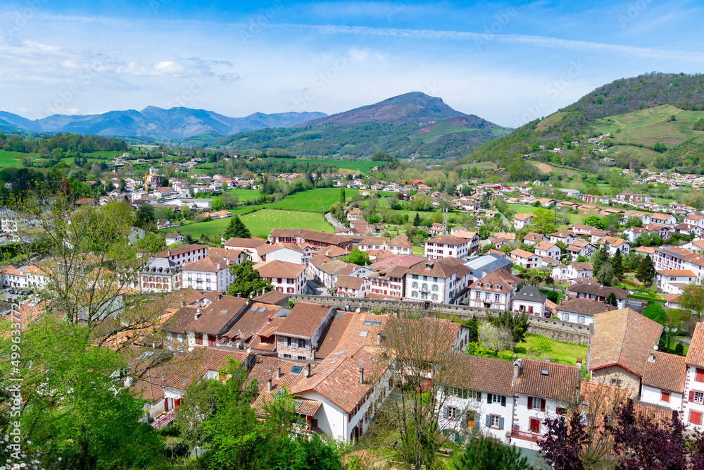 Cityscape of Saint Jean Pied de Port village, France. Views of the entire town with a panoramic view of a colorful landscape. Horizontal photography.