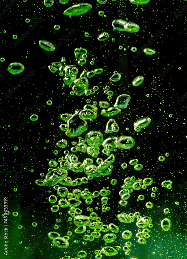 Air bubbles green on a black background Air bubbles green on a black background