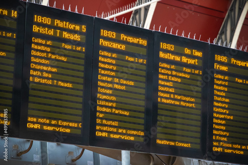 Departure boards, train timetable at London Paddington station photo