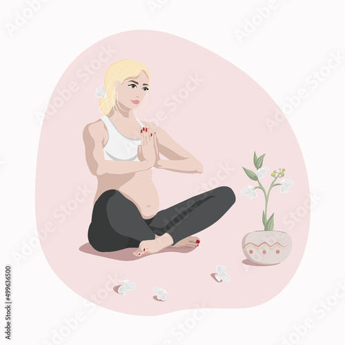 Pregnant girl in lotus position doing yoga