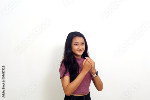 Calm relaxed asian girl with friendly expression. Isolated on white background