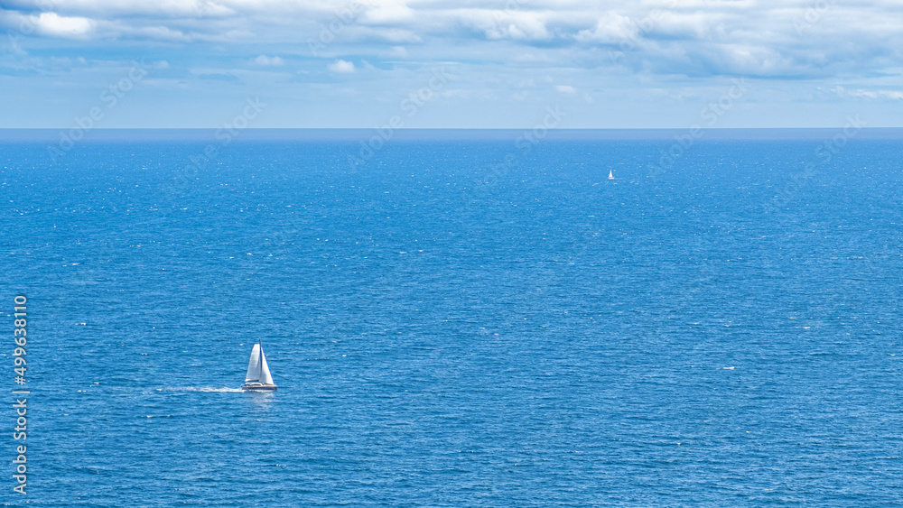 Fototapeta premium The sea with sailboat from far and near