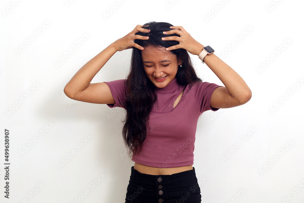 Asian girl holding dizzy head isolated on white background Asian girl holding dizzy head isolated on white background