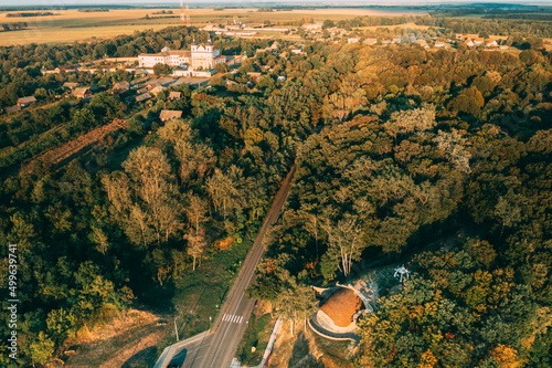 Aerial View Of Jesuit Collegium Complex. Top View Of Parking Lot Of Primitive Man Upper Period Of The Paleolithic 26 Thousand Years Ago . Drone View Of Beautiful European Nature From High Attitude In photo