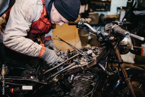 motorcycle repair in the garage, service maintenance of motorcycles, repair of the fuel system.