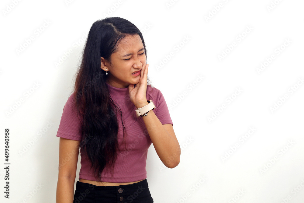 Beautiful young woman suffering from toothache. Have a hypersensitive teeth. Isolated on white Beautiful young woman suffering from toothache. Have a hypersensitive teeth. Isolated on white