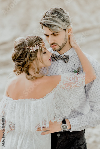The bride and groom in the desert. Wedding in the sands of Dubai.
