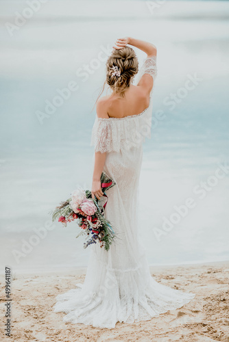 Beautiful bride on the river Bank. Beautiful bride posing.