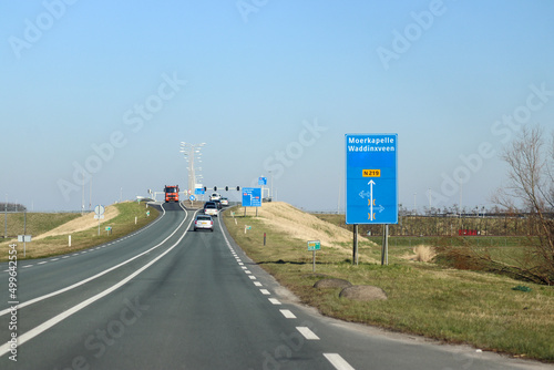Blue direction and information sign for the directions on road N219 in Nieuwerkerk aan den IJssel