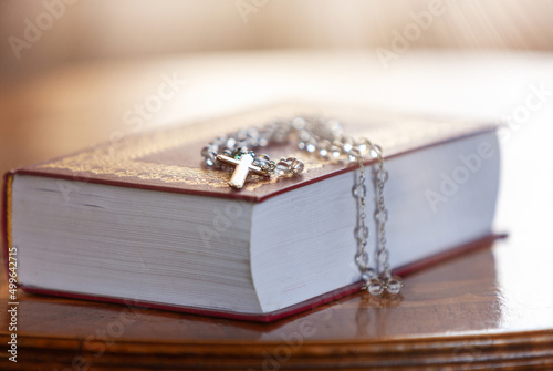 Holy Bible and Rosary with cross