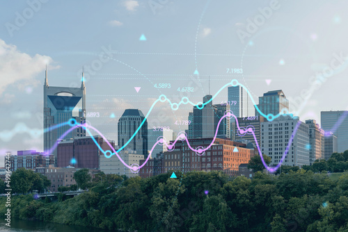 Panoramic skyline view of Broadway district of Nashville over Cumberland River at day time, Tennessee, USA. Forex graph hologram. The concept of internet trading, brokerage and fundamental analysis